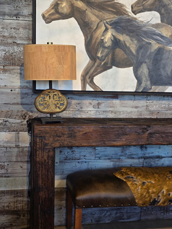 Console table, lamp and wall art.