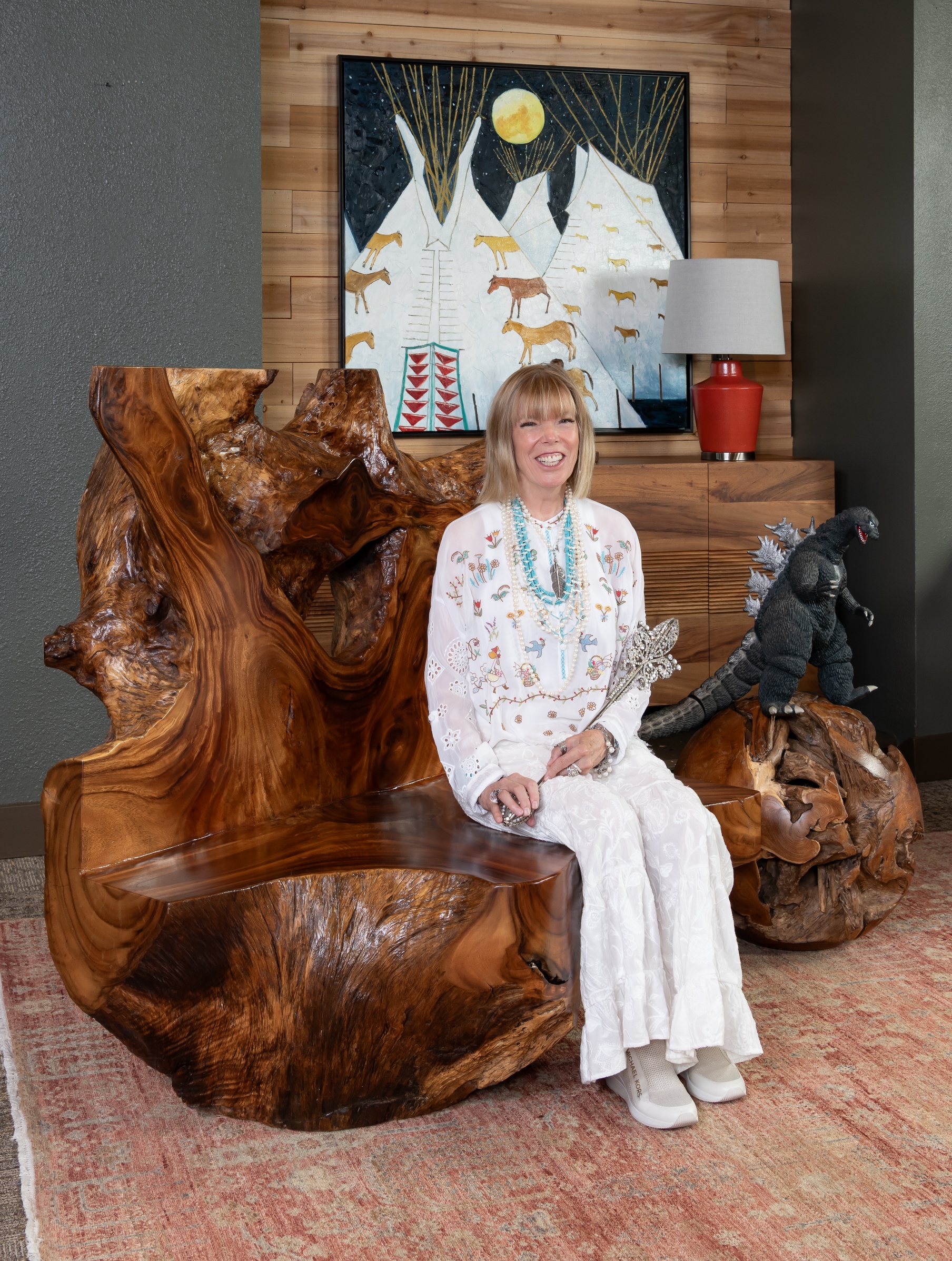 Image of Katherine Snedeker sitting on a stool